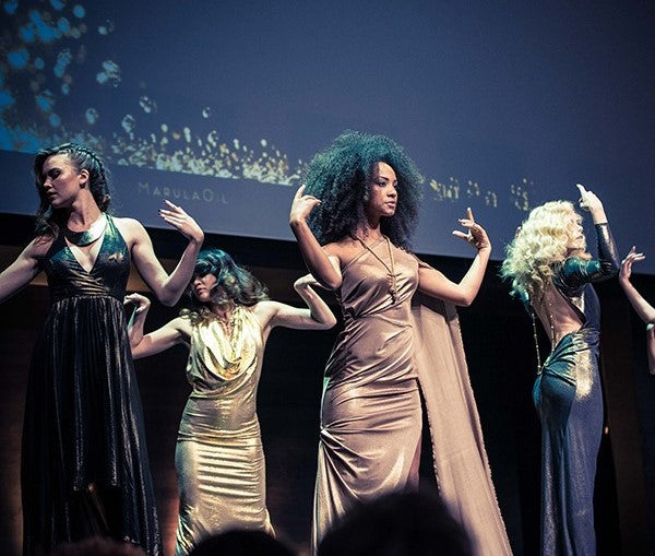 Mixed Models in dresses on stage showing diffrent Hairstyles