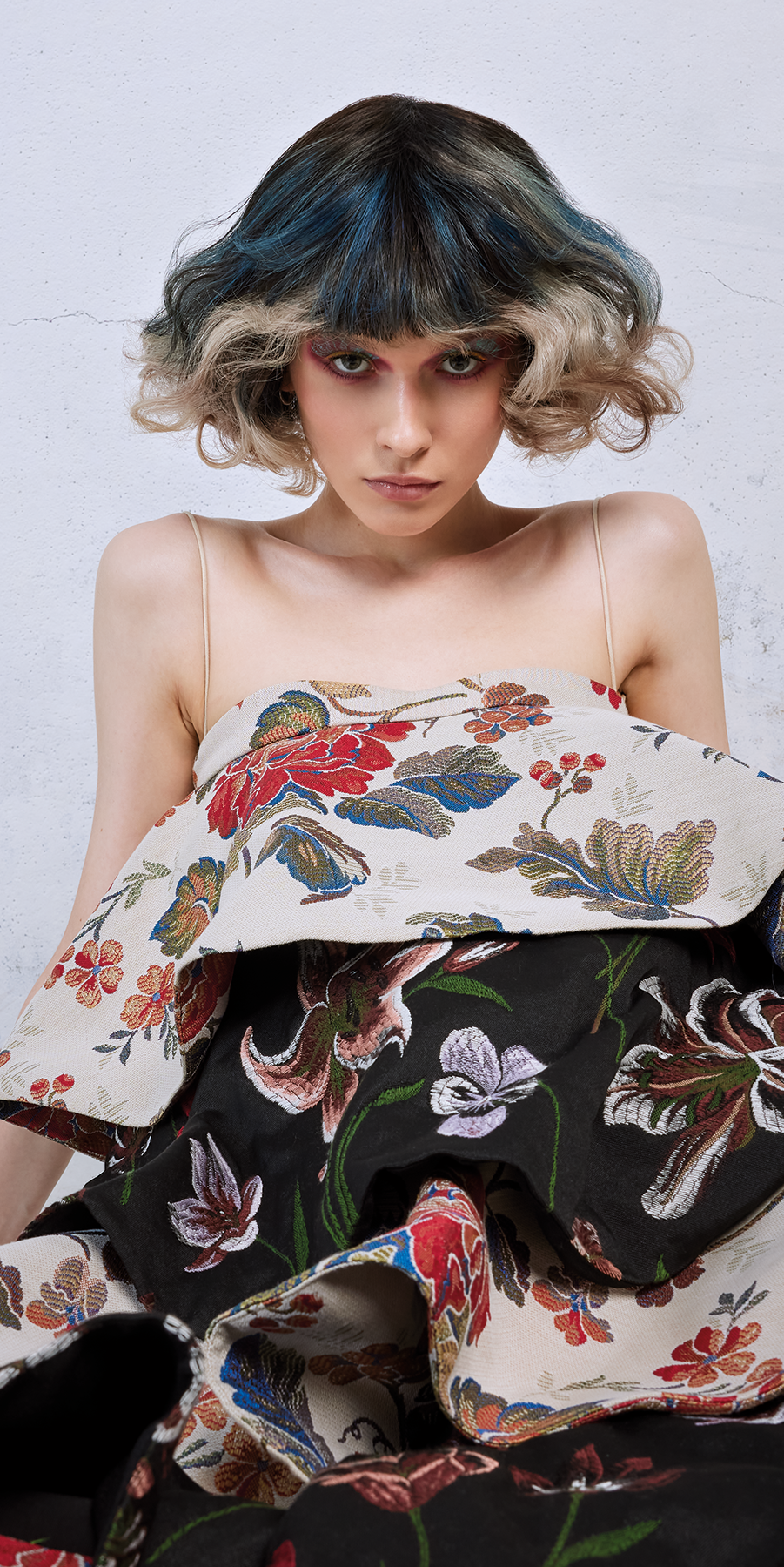 Girl with Colorfull hair and make-up in flowered dress 